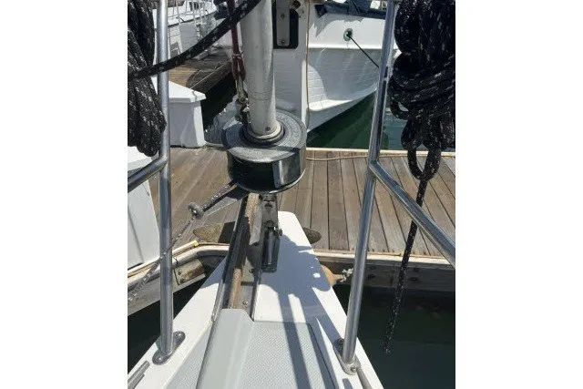Slide: The Image of Bow of 1990 Catalina 42 sailboat docked, featuring stainless steel fittings and rigging. - 38