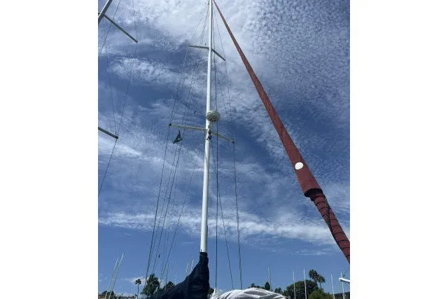 Slide: The Image of Sailboat mast of a 1990 Catalina 42 against a cloudy sky. - 46