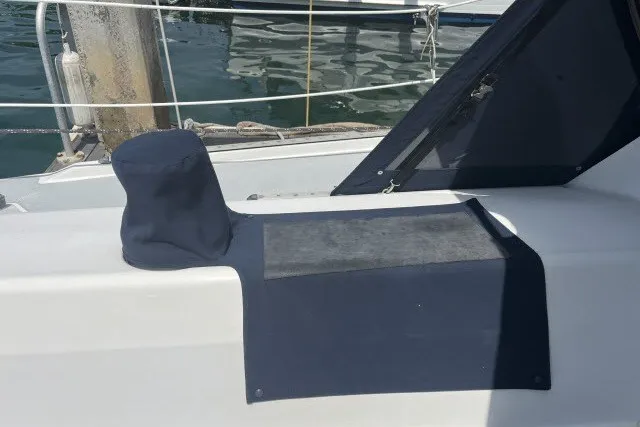Slide: The Image of Catalina 42 sailboat deck with navy covers, 1990 model, docked at marina. - 29