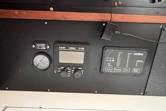 Slide: The Image of Control panel of a 1990 Catalina 42 sailboat with navigation and monitoring instruments. - 8