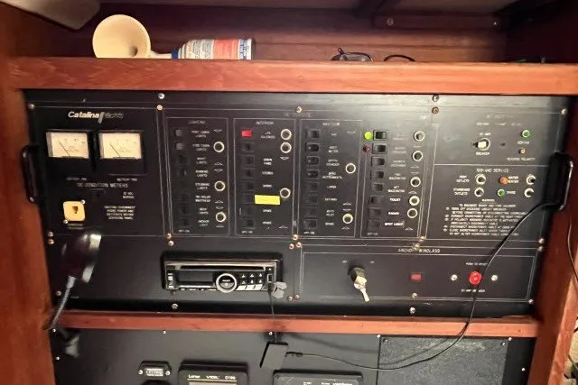 Slide: The Image of Electrical control panel of a 1990 Catalina 42 sailboat with various switches and meters. - 7