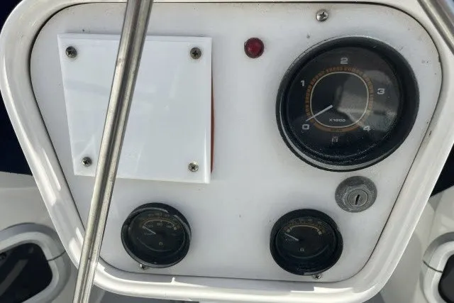 Slide: The Image of Control panel of a 1990 Catalina 42 sailboat with gauges and switches. - 25