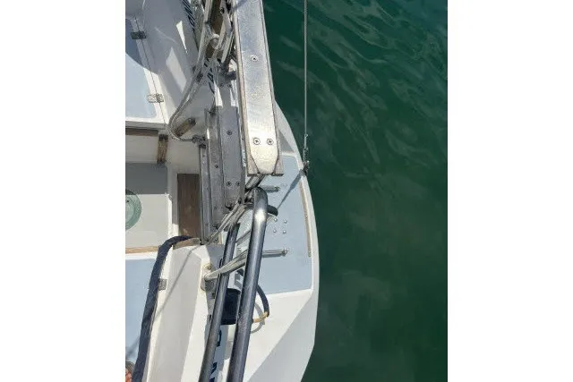 Slide: The Image of Sailboat deck view of a 1990 Catalina 42 on calm water. - 32