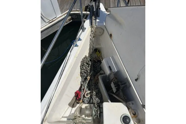Slide: The Image of Anchor chain and equipment on a 1990 Catalina 42 sailboat deck. - 39