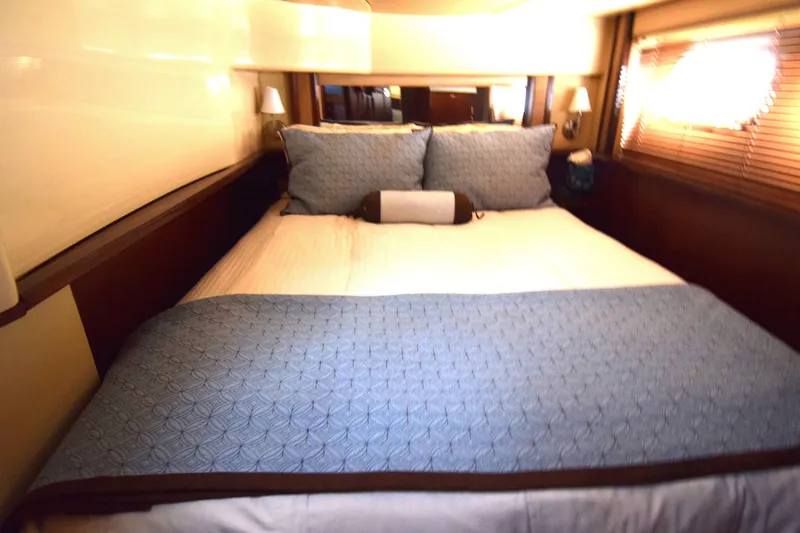 Slide: The Image of Luxurious bedroom interior of 2005 Sea Ray 500 Sedan Bridge yacht. - 10