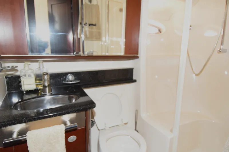 Slide: The Image of Luxurious bathroom in 2005 Sea Ray 500 Sedan Bridge yacht with modern fixtures. - 13