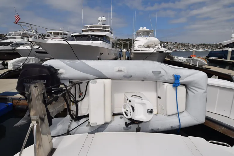 Slide: The Image of 2005 Sea Ray 500 Sedan Bridge yacht docked with inflatable boat and motor. - 28