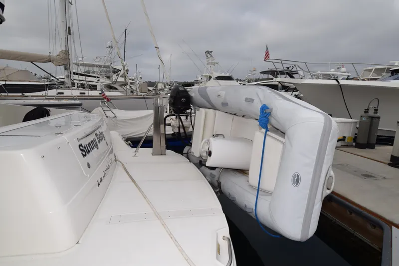 Slide: The Image of 2005 Sea Ray 500 Sedan Bridge yacht docked with inflatable boat attached. - 35