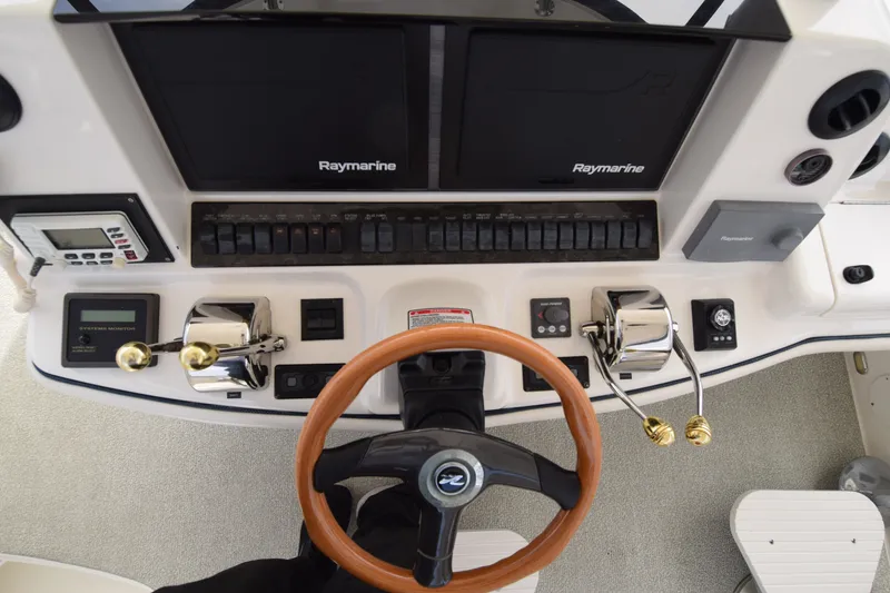 Slide: The Image of Control panel of a 2005 Sea Ray 500 Sedan Bridge with Raymarine navigation equipment. - 21