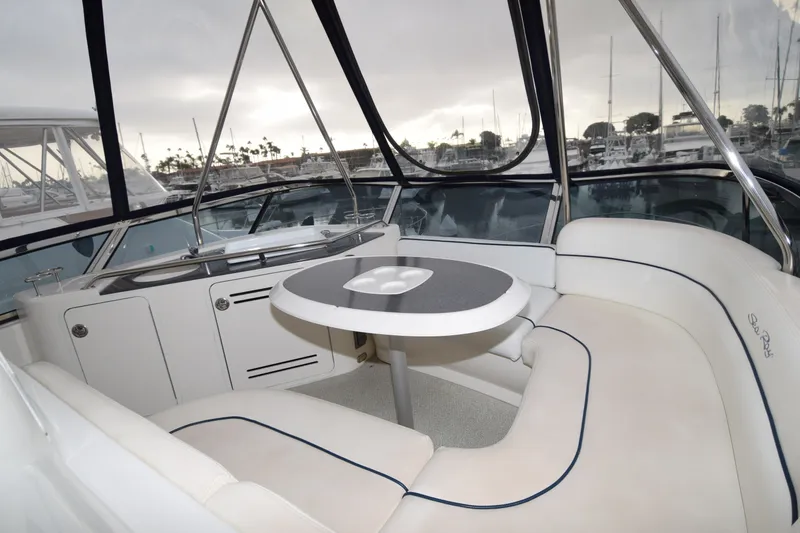 Slide: The Image of Luxurious interior of 2005 Sea Ray 500 Sedan Bridge yacht with seating and table. - 41