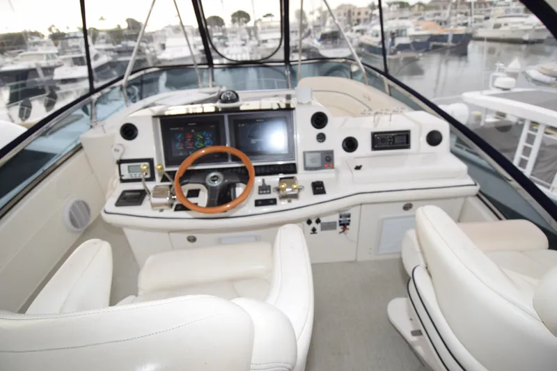 Slide: The Image of Cockpit of 2005 Sea Ray 500 Sedan Bridge yacht with modern navigation equipment. - 40