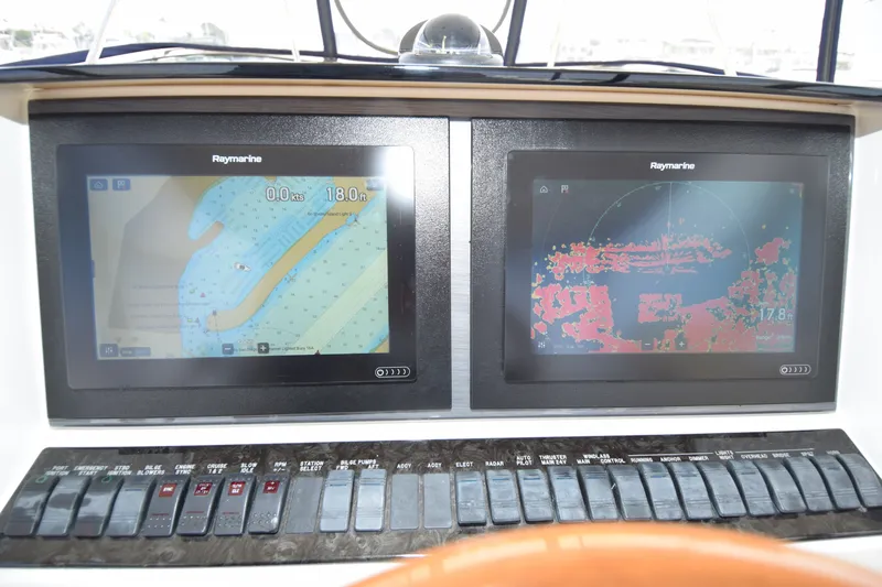 Slide: The Image of Raymarine navigation displays on 2005 Sea Ray 500 Sedan Bridge yacht dashboard. - 23