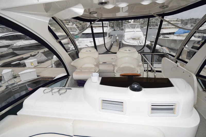 Slide: The Image of Luxurious interior of a 2005 Sea Ray 500 Sedan Bridge yacht at a marina. - 32
