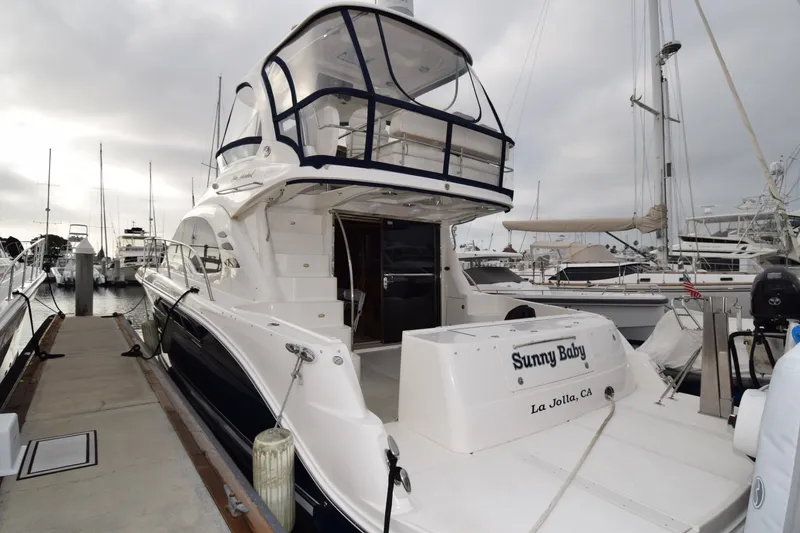 Slide: The Image of 2005 Sea Ray 500 Sedan Bridge yacht docked at marina, rear view. - 36