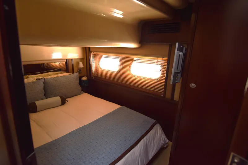 Slide: The Image of Luxurious bedroom interior of 2005 Sea Ray 500 Sedan Bridge yacht. - 11