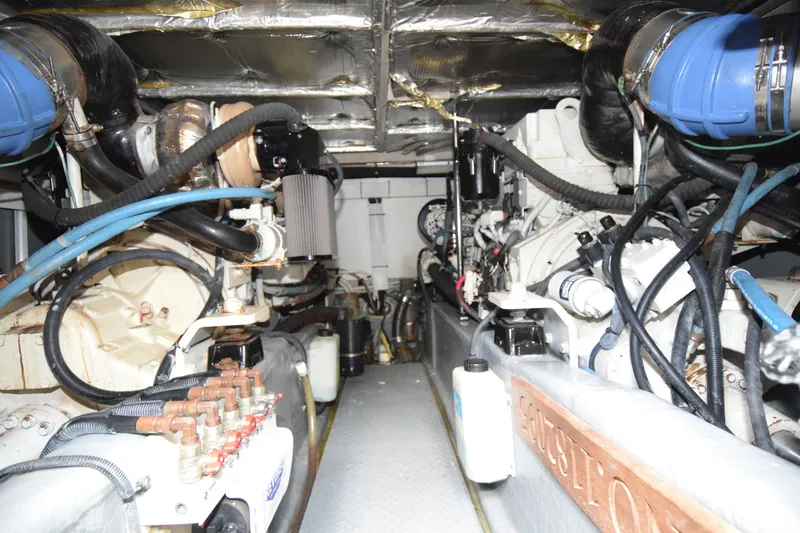 Slide: The Image of Engine room of a 2005 Sea Ray 500 Sedan Bridge yacht, showcasing mechanical components. - 30