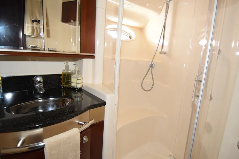 Slide: The Image of Luxurious bathroom in 2005 Sea Ray 500 Sedan Bridge yacht with shower and sink. - 12