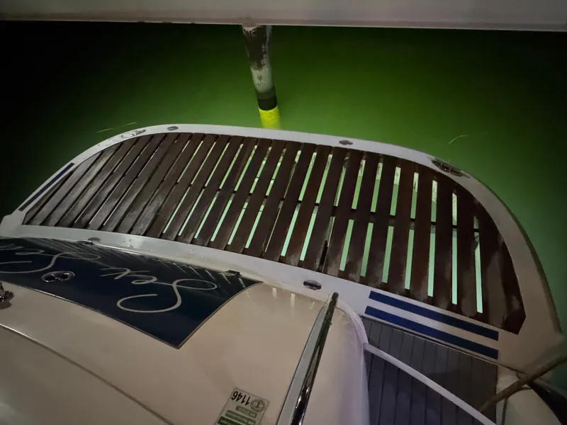 Slide: The Image of The image shows the stern of a 2000 Sunseeker Predator 56 docked at a pier. - 14