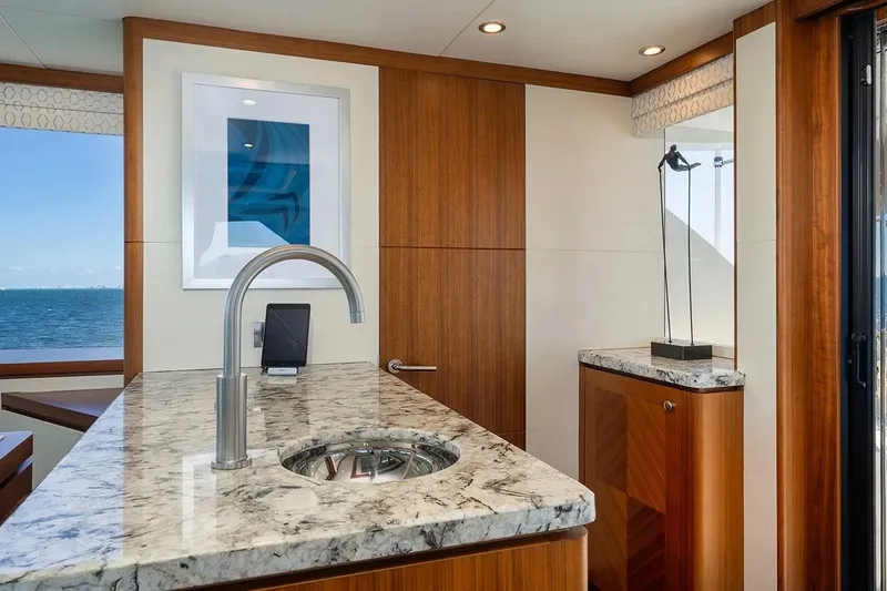 Slide: The Image of Luxurious interior of 2016 Ocean Alexander 100 Skylounge Megayacht with marble countertop and ocean view. - 21