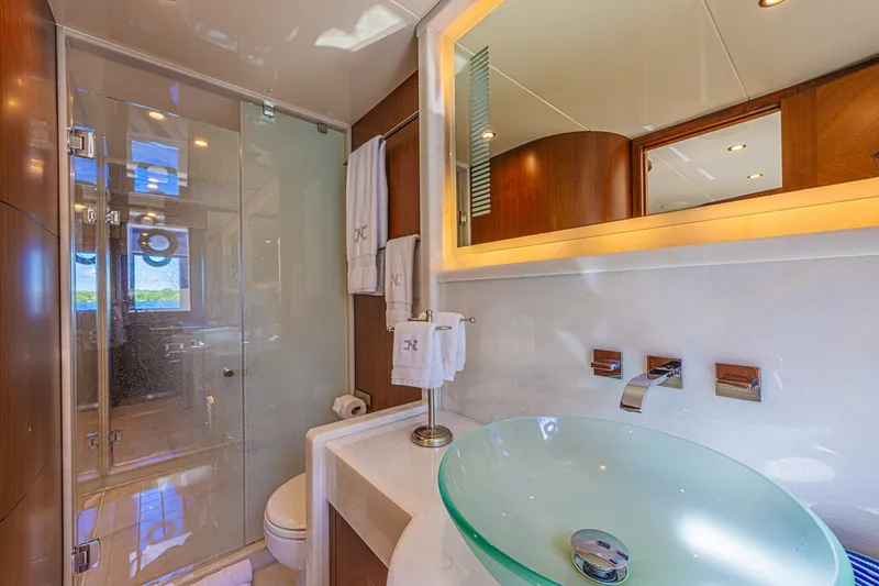 Slide: The Image of Luxurious bathroom in 2016 Ocean Alexander 100 Skylounge Megayacht with glass sink and shower. - 30