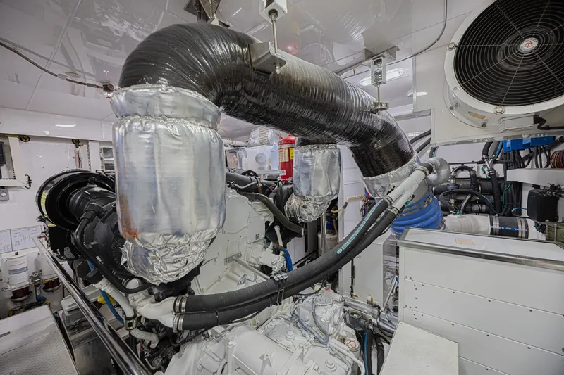 Slide: The Image of Engine room of 2016 Ocean Alexander 100 Skylounge Megayacht, showcasing advanced machinery and piping. - 44