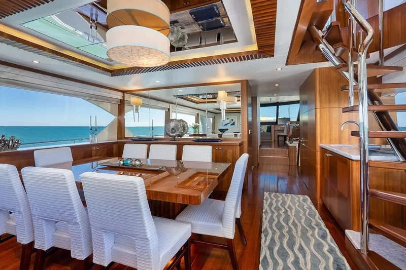 Slide: The Image of Luxurious dining area inside 2016 Ocean Alexander 100 Skylounge Megayacht with ocean view. - 19