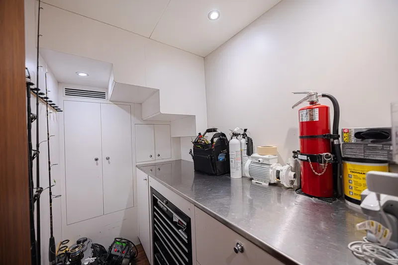 Slide: The Image of Utility room on 2016 Ocean Alexander 100 Skylounge Megayacht with fire extinguisher and tools. - 40