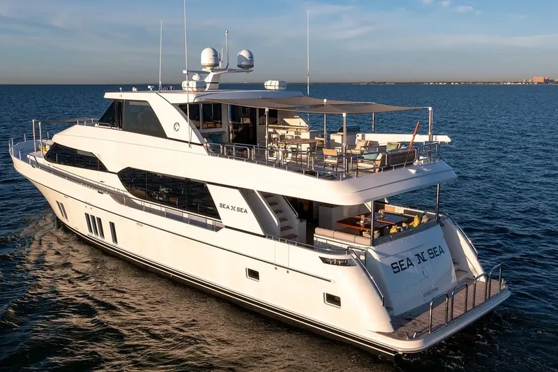 Slide: The Image of 2016 Ocean Alexander 100 Skylounge Megayacht cruising on open water. - 31