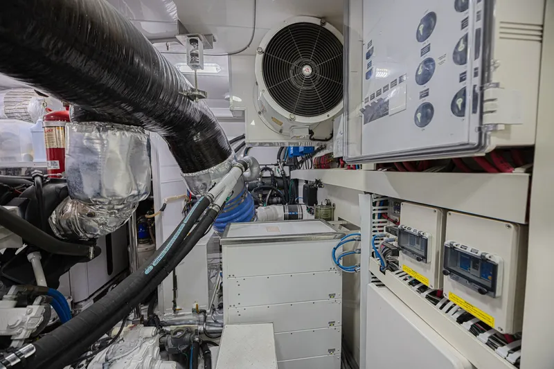 Slide: The Image of Engine room of 2016 Ocean Alexander 100 Skylounge Megayacht with complex machinery and controls. - 42