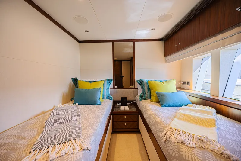Slide: The Image of Luxurious twin bedroom on 2016 Ocean Alexander 100 Skylounge Megayacht with vibrant pillows. - 35