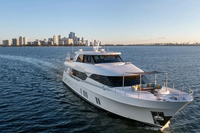Slide: The Image of 2016 Ocean Alexander 100 Skylounge Megayacht cruising near city skyline at sunset. - 35
