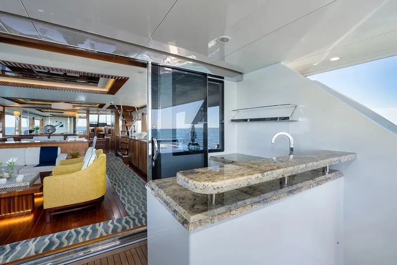 Slide: The Image of Luxurious interior of 2016 Ocean Alexander 100 Skylounge Megayacht with elegant seating and bar area. - 16