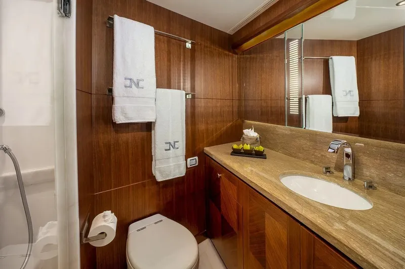 Slide: The Image of Luxurious bathroom in 2016 Ocean Alexander 100 Skylounge Megayacht with elegant wood paneling. - 30