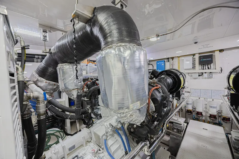 Slide: The Image of Engine room of 2016 Ocean Alexander 100 Skylounge Megayacht, showcasing complex machinery and piping. - 43