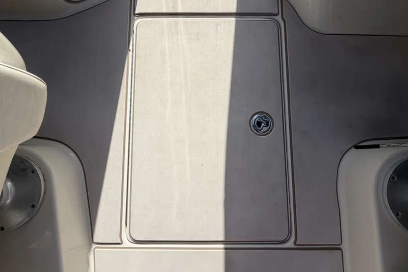 Slide: The Image of Deck of 2008 Sea Ray 240 Sundeck boat with storage compartment. - 30