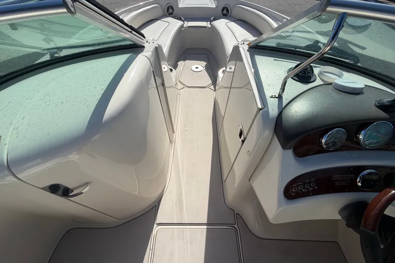 Slide: The Image of 2008 Sea Ray 240 Sundeck interior with sleek dashboard and spacious seating. - 47