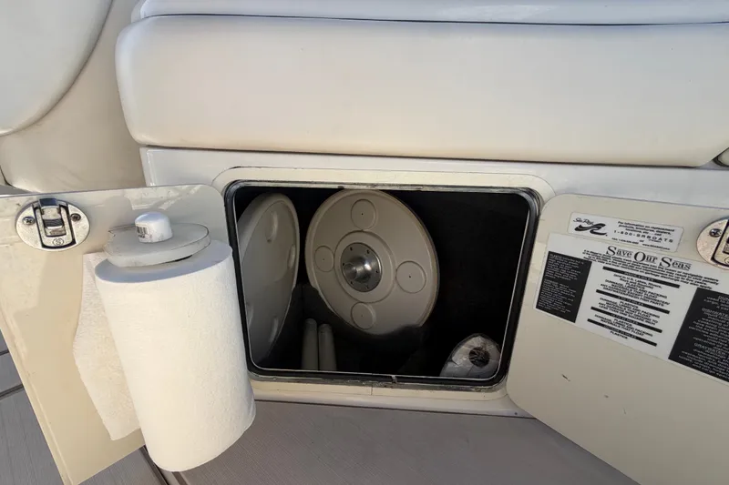 Slide: The Image of Storage compartment on a 2008 Sea Ray 240 Sundeck boat with paper towel holder. - 26