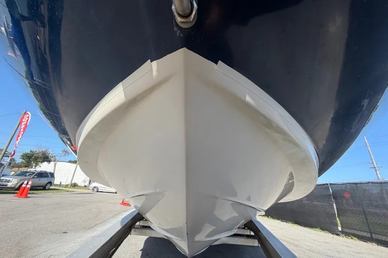 Slide: The Image of 2008 Sea Ray 240 Sundeck boat hull on trailer, viewed from below. - 14
