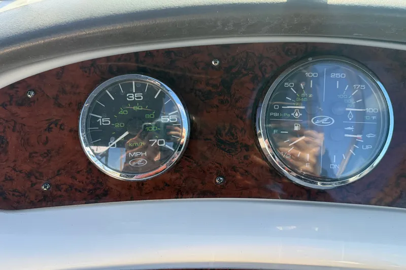 Slide: The Image of Dashboard of a 2008 Sea Ray 240 Sundeck showing speedometer and gauges. - 41