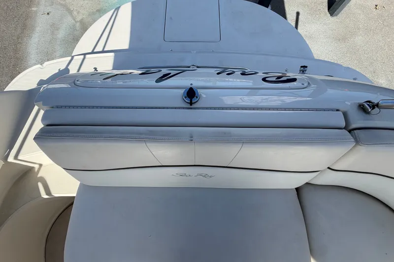 Slide: The Image of 2008 Sea Ray 240 Sundeck boat interior with white seating and deck view. - 85