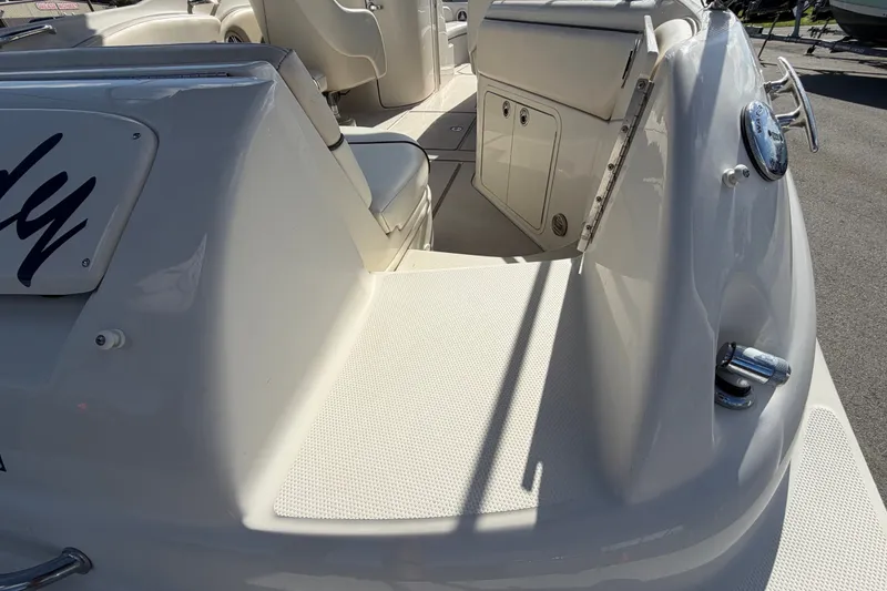 Slide: The Image of 2008 Sea Ray 240 Sundeck boat interior with seating and storage compartments. - 20