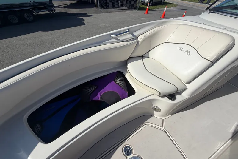 Slide: The Image of 2008 Sea Ray 240 Sundeck boat interior with storage compartment open. - 67