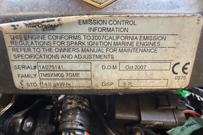 Slide: The Image of Engine label on a 2008 Sea Ray 240 Sundeck, showing specifications and serial number. - 94