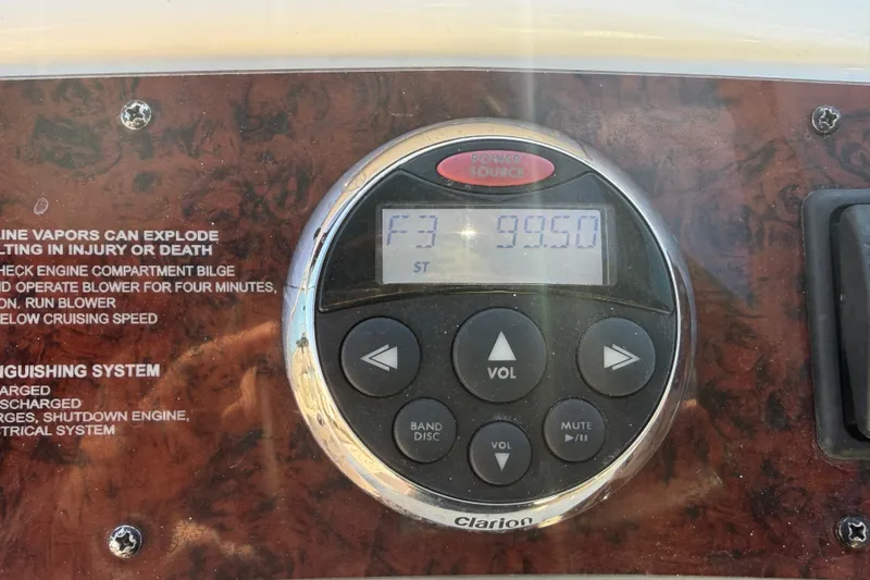 Slide: The Image of Close-up of a Clarion audio control panel on a 2008 Sea Ray 240 Sundeck boat. - 44