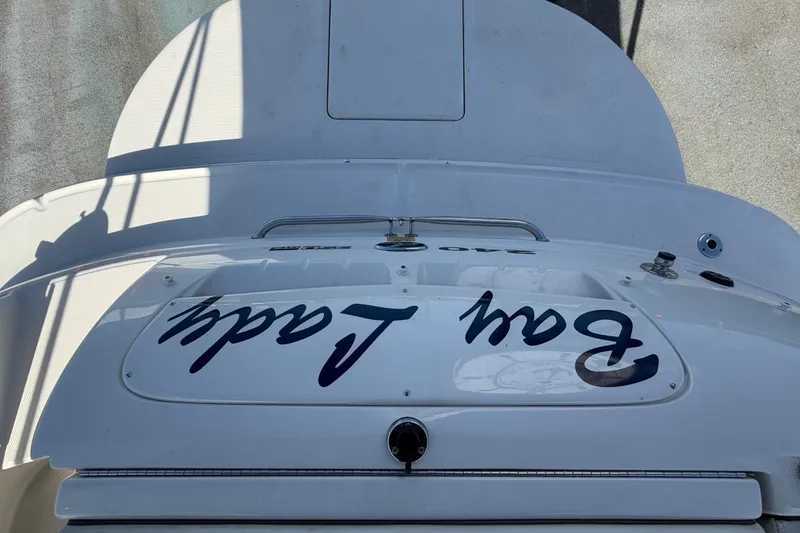 Slide: The Image of 2008 Sea Ray 240 Sundeck boat stern view with custom lettering. - 86
