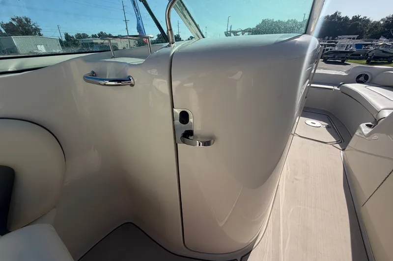 Slide: The Image of 2008 Sea Ray 240 Sundeck interior, featuring sleek design and comfortable seating. - 34