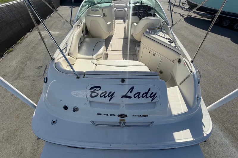 Slide: The Image of 2008 Sea Ray 240 Sundeck boat named "Bay Lady" with spacious seating and sleek design. - 15