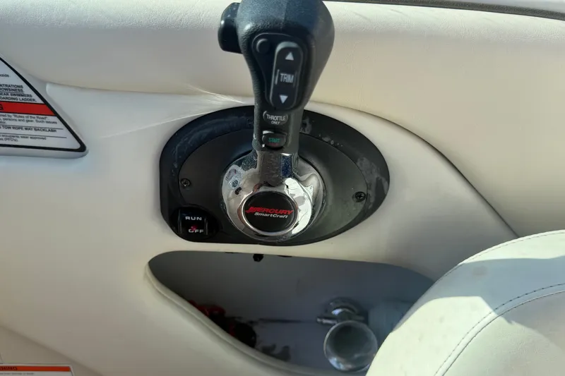 Slide: The Image of 2008 Sea Ray 240 Sundeck throttle control with Mercury SmartCraft system. - 46