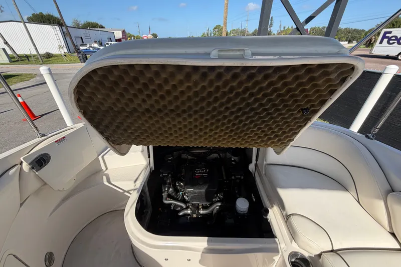 Slide: The Image of Open engine compartment of 2008 Sea Ray 240 Sundeck boat, showcasing interior details. - 82