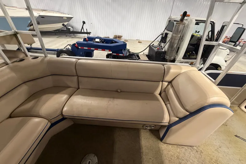 Slide: The Image of Interior view of a 2014 South Bay 526 CRUDS TRIPLE pontoon boat with beige seating. - 13